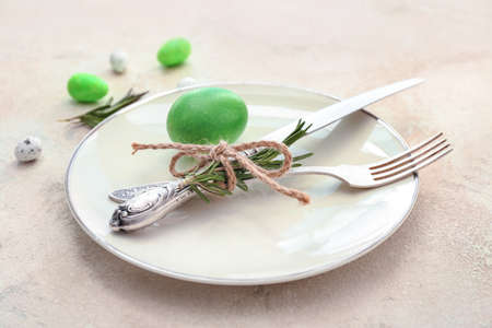 Beautiful Easter table setting on light backgroundの写真素材