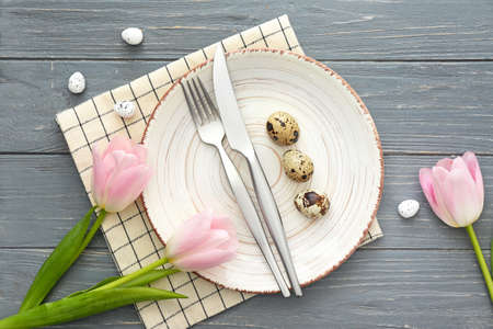 Beautiful Easter table setting on wooden background