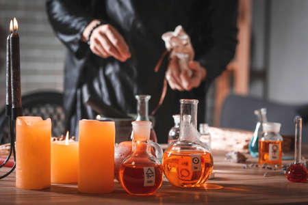 Male alchemist making elixir in laboratoryの写真素材