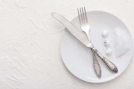 Beautiful Easter table setting on white backgroundの写真素材