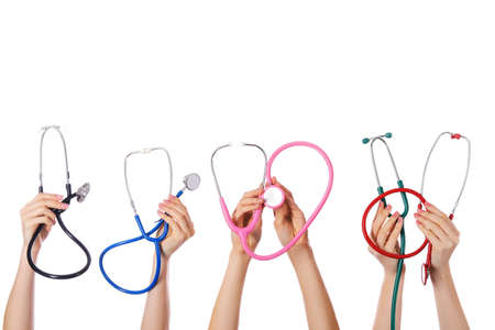 Many hands with stethoscopes on white backgroundの写真素材