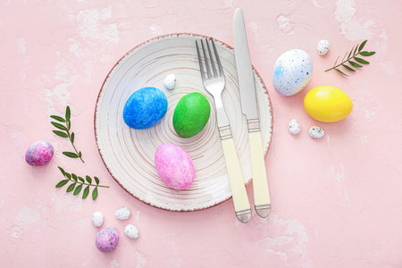 Beautiful Easter table setting on color backgroundの写真素材