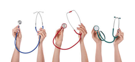Many hands with stethoscopes on white backgroundの写真素材