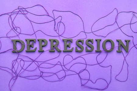 Text DEPRESSION with threads on color backgroundの写真素材