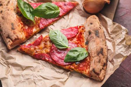 Slices of tasty pizza on table, closeup