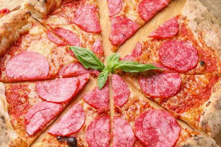 Tasty pizza on wooden board, closeupの写真素材