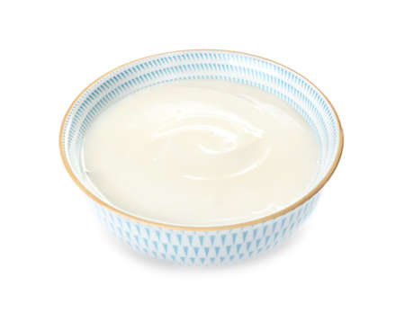 Bowl with tasty cream cheese on white backgroundの写真素材