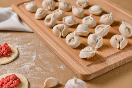 Making of tasty dumplings on color backgroundの写真素材