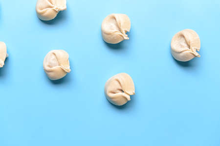 Raw fresh dumplings on color backgroundの写真素材