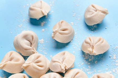Raw fresh dumplings on color backgroundの写真素材