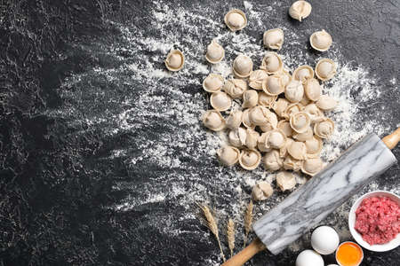 Making of tasty dumplings on dark backgroundの写真素材