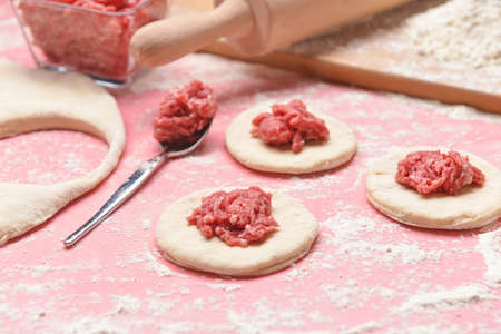 Making of tasty dumplings on color backgroundの写真素材