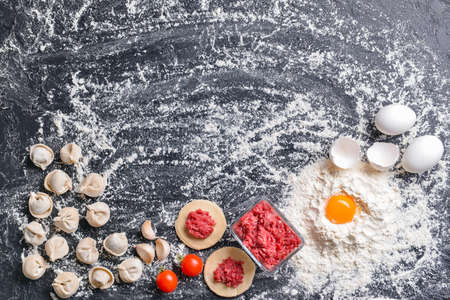 Making of tasty dumplings on dark backgroundの写真素材