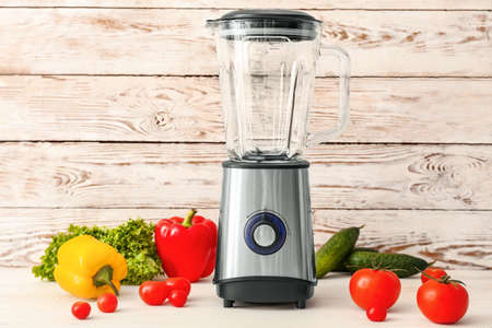 Blender with ingredients for healthy smoothie on tableの写真素材