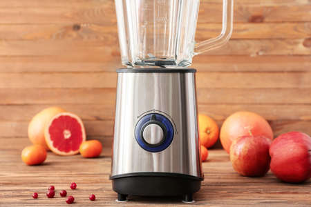 Blender with ingredients for healthy smoothie on tableの写真素材