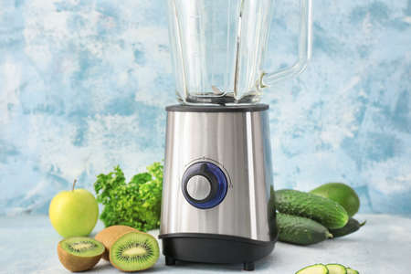 Blender with ingredients for healthy smoothie on tableの写真素材