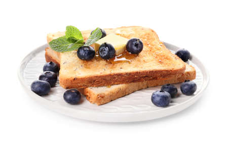 Tasty toasted bread with honey, butter and berries on white backgroundの写真素材