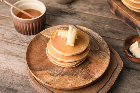 Tasty pancakes with butter on plateの写真素材