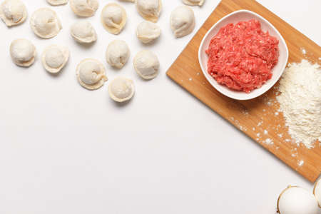 Preparing of tasty dumplings on white backgroundの写真素材