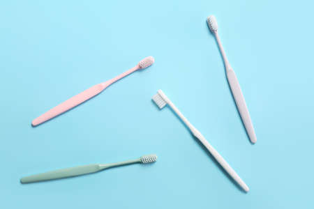 Tooth brushes on color backgroundの写真素材