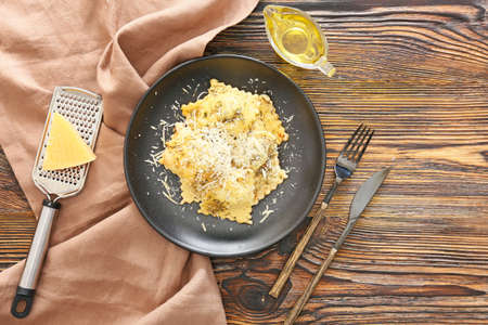 Plate with tasty ravioli on tableの写真素材