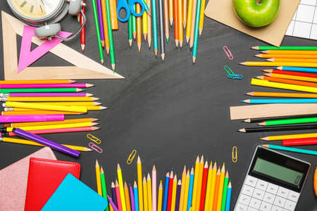 Frame made of school supplies on dark backgroundの写真素材