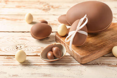 Tasty chocolate Easter eggs on wooden backgroundの写真素材