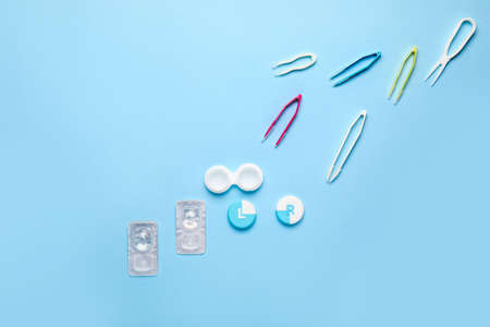 Containers for contact lenses and tweezers on color backgroundの写真素材