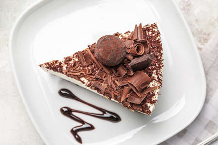 Piece of tasty chocolate cheesecake on plateの写真素材