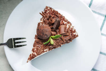 Piece of tasty chocolate cheesecake on plateの写真素材