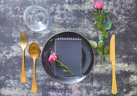 Beautiful simple table setting on dark backgroundの写真素材