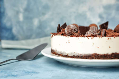 Tasty chocolate cheesecake on color backgroundの写真素材