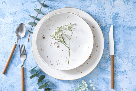 Beautiful simple table setting on color background