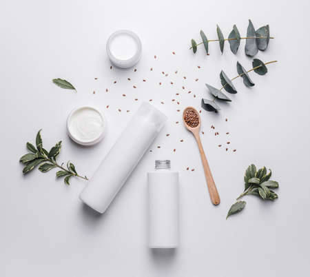 Composition with shampoo and cosmetics on white backgroundの写真素材