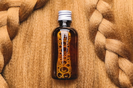 Bottle of shampoo on healthy hairの写真素材