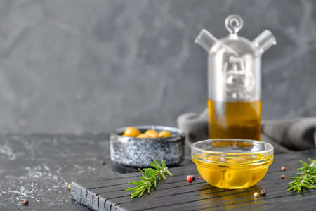 Tasty olive oil on dark backgroundの写真素材