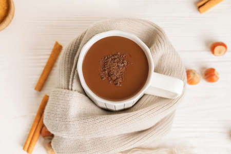 Cup of hot chocolate on white wooden tableの写真素材