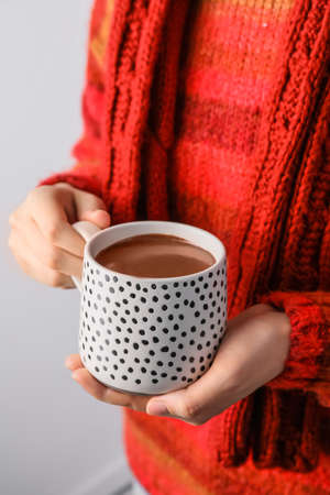 Woman with cup of hot chocolate, closeupの写真素材
