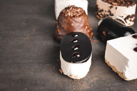 Tasty cakes on dark backgroundの写真素材