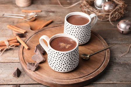 Cups of hot chocolate on wooden tableの写真素材