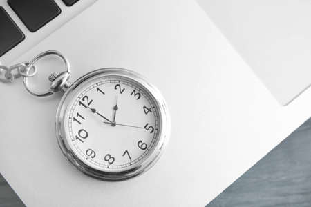 Clock on laptop, closeup. Time management conceptの写真素材