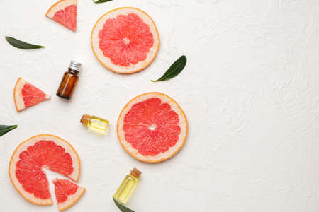 Composition with grapefruit essential oil on white backgroundの写真素材