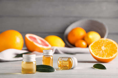 Bottles of citrus essential oils on tableの写真素材