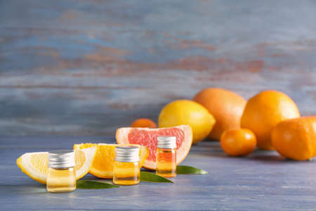 Bottles of citrus essential oils on tableの写真素材