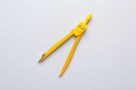 Pair of compasses on gray backgroundの写真素材