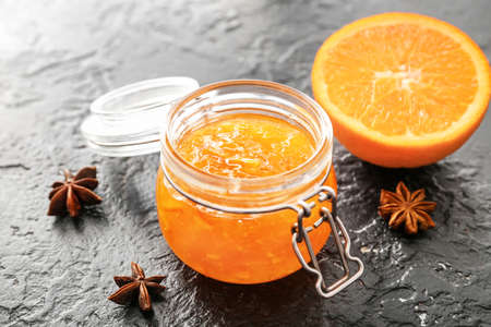 Jar of orange jam on dark backgroundの写真素材