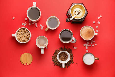 Cups of coffee with sugar on color backgroundの写真素材