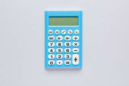 Modern calculator on gray backgroundの写真素材