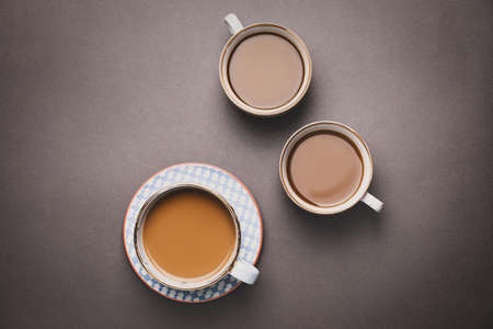 Cups of different coffee on dark backgroundの写真素材