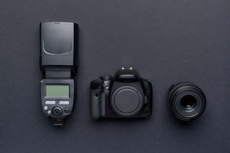 Modern photographer's equipment on dark backgroundの写真素材